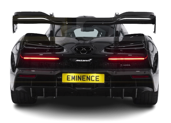Rear view of a black McLaren sports car with a large rear wing and a license plate that reads "EMINENCE," available for hire.